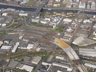 Oblique aerial view of the M74 extension going through the Port Eglinton area centred on junction with the M74 at the Kingston Bridge, taken from the SE.