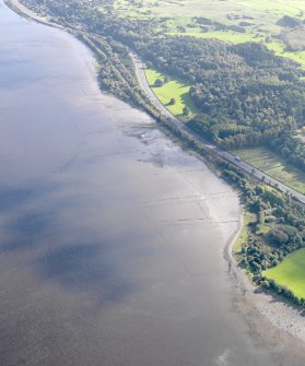 Oblique aerial view centred on the remains of the timber ponds, taken from the NW.