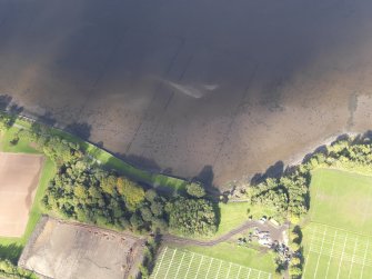 Oblique aerial view centred on the remains of the timber ponds with the playing fields adjacent, taken from the S.