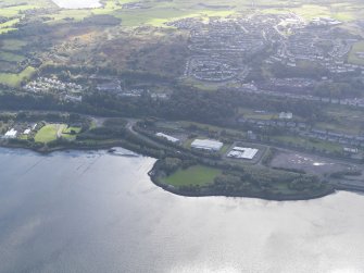 General oblique aerial view looking across the remains of the timber ponds towards Port Glasgow, taken from the N.