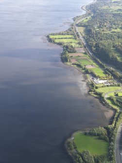 Oblique aerial view centred on the remains of the timber ponds with the playing fields adjacent, taken from the WNW.