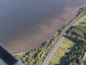 Oblique aerial view centred on the remains of the timber ponds, taken from the SW.