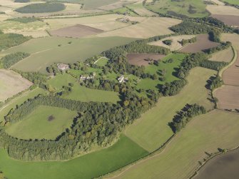 Oblique aerial view centred on the policies and parkland of Mountquhanie House, taken from the SW.