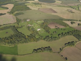 Oblique aerial view centred on the policies and parkland of Mountquhanie House, taken from the SSW.