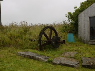 Detail of mill gear wheel used as garden 'sculpture'.