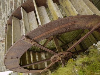 View of original water wheel with modern replacement buckets.