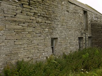 View of E elevation showing original windows and reveals.