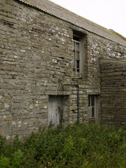 View of E elevation showing original windows and reveals. This would have been the main access are for the miller.