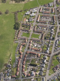 General oblique aerial view of Tillicoultry, centred on area between Jamieson Gardens and Walker Terrace, taken from the W