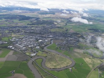 General oblique aerial view of the city centred on the railway station looking SW across the Touch Hills, taken from the NE.