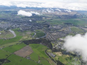 General oblique aerial view of the city centred on the Wallace Monument looking SW across the Touch Hills, taken from the NE.