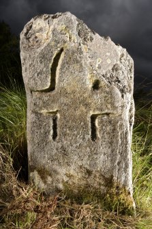View of small cross incised stone