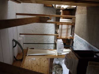 Interior. View of hopper floor, S range, second floor: hoppers supplying stones on S end of S range at far wall. Now converted to bed and breakfast accommodation.