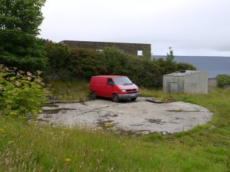 View of remains of 20,000 cubic feet capacity gasholder at HY25598 09765. The small building adjacent may be the former Meter House.