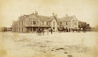 View of Huntly Arms Hotel, Aboyne with three carriages outside
Titled: 'Huntly Arms Hotel. 205. E G.'
