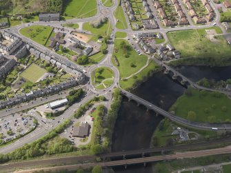 Oblique aerial view of the city centred on the Customs Roundabout, taken from the E.