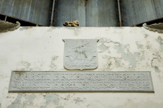 Interior. Detail. View of text panel and tablet with image of a sailing boat, situated at high level on the West wall of the Argyll Mausoleum. The text panel reads: 'Their sail is furled, their voyage oe'r, their souls have reached Christ's holy shore'.