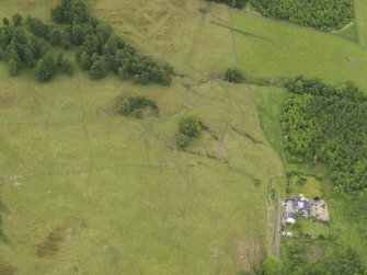 Oblique aerial view of the remains of Upper Farrochil disused quarry, taken from the ENE.