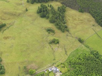 Oblique aerial view of the remains of Upper Farrochil disused quarry, taken from the NNE.