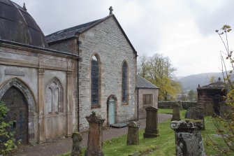 View of the North elevation of Church of St Munn's taken from North-East. Part view of adjoining Argyll Mausoleum.