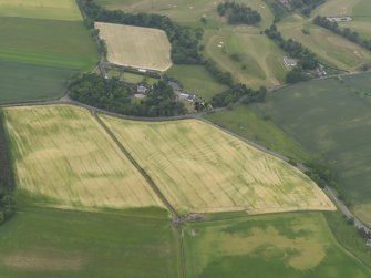 Oblique aerial view of the cropmarks of the rig with Balchrystie House beyond, looking N.
