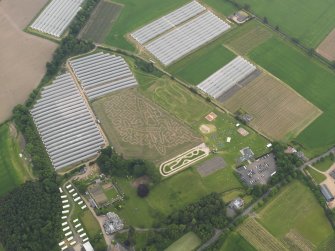 Oblique aerial view of the spitfire maze at Cairney Lodge, looking WSW.
