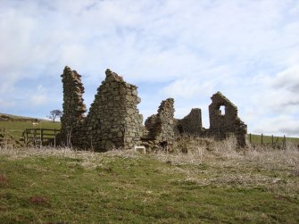 Windy Windshiel, showing tower house remains in foreground and gable of Improvement era house beyond.