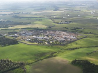 General oblique aerial view of the State Hospital for Scotland and Northern Ireland at Carstairs during rebuilding works, taken from the NW.