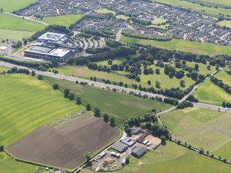 General oblique aerial view looking across the M9 towards Bonnytoun House and Sun Microsystems, taken from the NW.