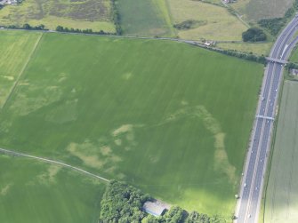 Oblique aerial view of the cropamrks of the possible coal pits and other pits, taken from the ENE.