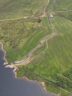 Oblique aerial view of the grassmarks of the possible barrow at Cnocbreac, Jura, taken from the NW.