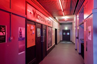 View of corridor and entrance doors to Vic Cafe Bar within Student Union building