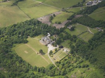 Oblique aerial view of Castle Toward country house and policies, taken from the SE.