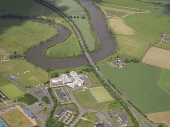 General oblique aerial view of the A91 crossing the River Forth and the newly constructed St Modan's Catholic High School, taken from the SSW