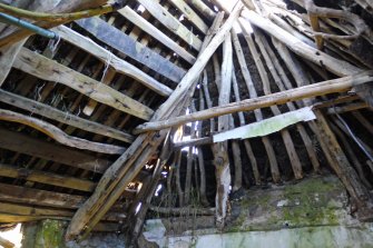 Interior. Detail. View of the timber roof construction in the traditional thatched cottage at 4 Balevullin. The photograph was taken in the North room of the cottage, looking North-West.