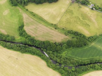 Oblique aerial view of the grassmarks of the Roman Fortlet at Kirkland, taken from the NNW.