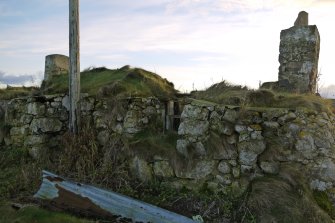 View of the North-Eastern elevation (principle) of the thatched cottage at Kilkenneth, Tiree, taken from the North.