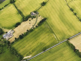 Oblique aerial view of the cropmarks of the Roman Temporary Camps at Mertoun Bridge, taken from the S.