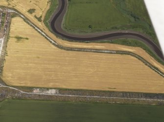 Oblique aerial view of the probably agricultural cropmark at Baldoon airfield, taken from the SW.