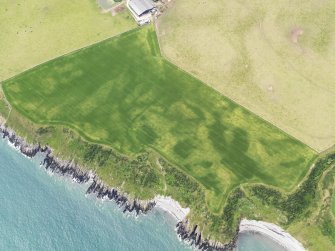 Oblique aerial view of The Dunnan promontary fort, taken from the NE.