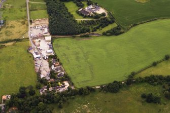 Oblique aerial view of the cropmarks of the possible enclosure, looking to the SSW.