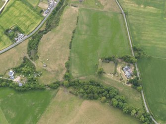 Oblique aerial view of Kingarth centred on the parchmarks of the possible long cists and the field boundaries, taken from the E.
