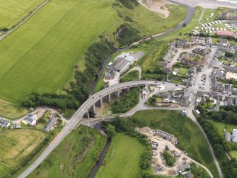 Oblique aerial view of the bridges at Inverbervie, looking to the SE.