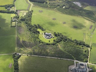 Oblique aerial view of Cairness House, looking to the SSW.