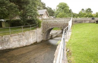 General view of bridge over the sluice leading from the leading the dam, from NW.