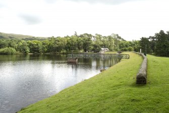 General view of the dam including pump station and access bridge, from W.