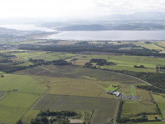 General oblique aerial view of Inverness with the Beauly Firth and Kessock Bridge beyond, looking to the NW.