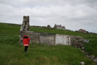 View from SE. Mr J Sherriff (RCAHMS) in picture.