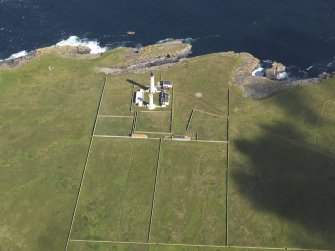 Oblique aerial view of the Muckle Skerry lighthouse, taken from the S.