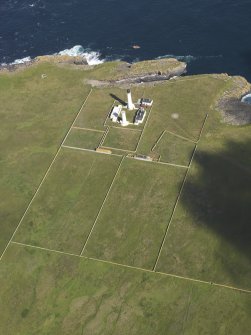 Oblique aerial view of the Muckle Skerry lighthouse, taken from the SSE.